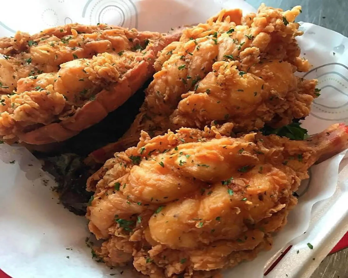 The preparation of Southern Deep Fried Lobster involves a carefully crafted batter or breading that complements the lobster's natural flavors. Common coatings include